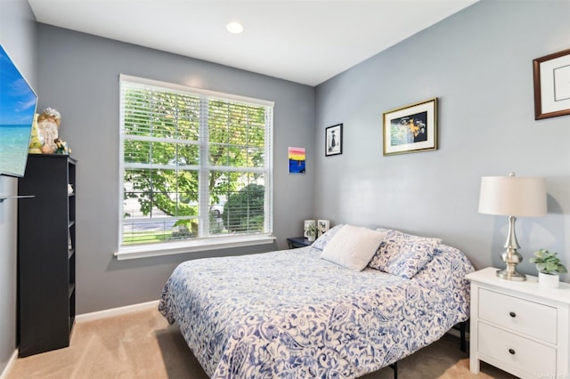 bedroom with light colored carpet