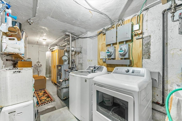 clothes washing area featuring separate washer and dryer