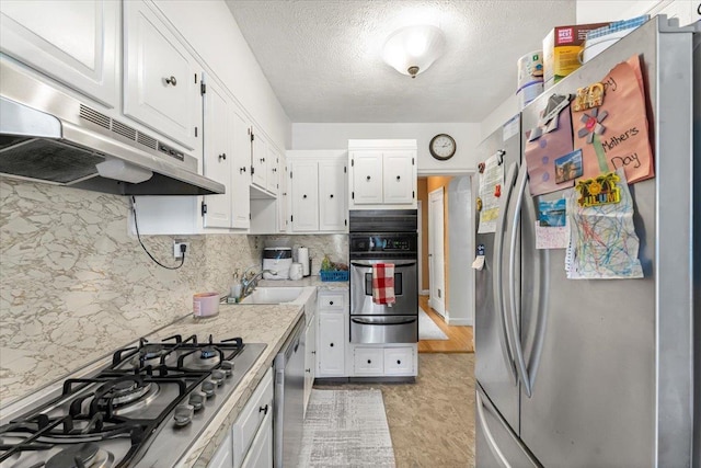 kitchen with sink, white cabinets, and stainless steel appliances