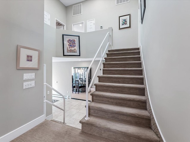 staircase with carpet flooring