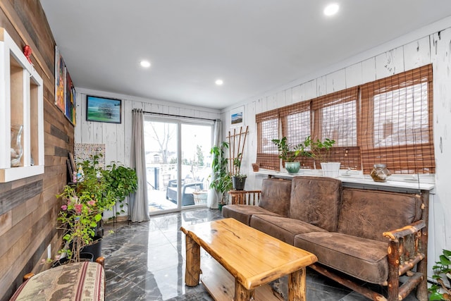 living room featuring wooden walls