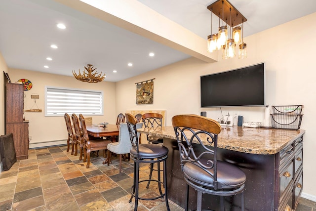 dining room with baseboard heating and a chandelier