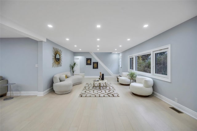 living area with light hardwood / wood-style flooring