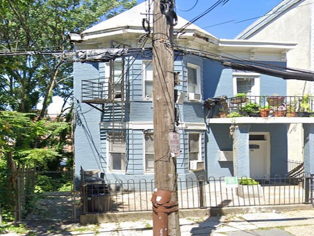 view of front of property with a balcony