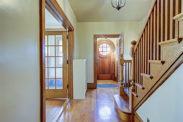 foyer entrance with light hardwood / wood-style floors