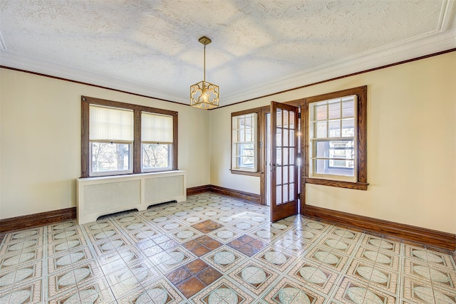 empty room featuring crown molding, radiator, a chandelier, and a textured ceiling