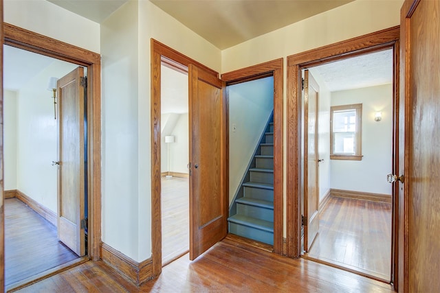 corridor with light hardwood / wood-style flooring