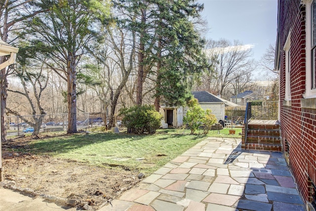 view of patio / terrace featuring an outbuilding