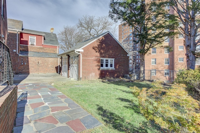 view of side of home featuring a lawn