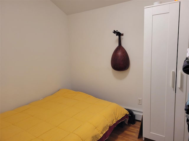 bedroom with hardwood / wood-style floors