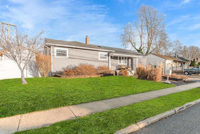 ranch-style house with a front lawn