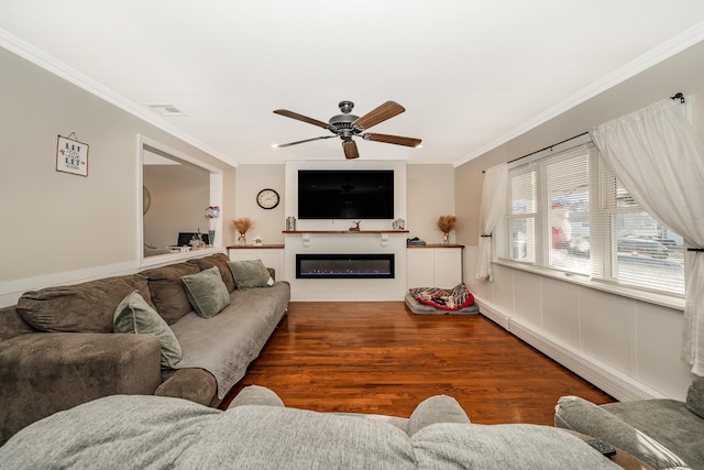 living room with ceiling fan, dark wood-type flooring, ornamental molding, and a baseboard radiator