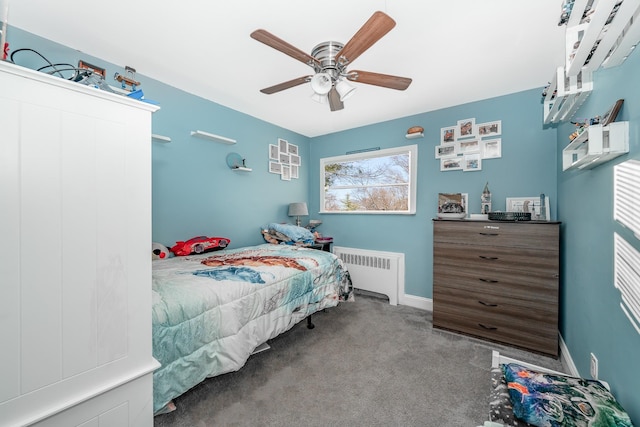 carpeted bedroom featuring ceiling fan and radiator heating unit