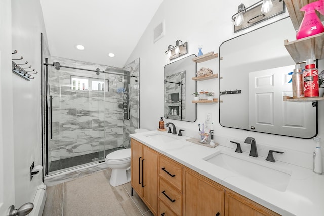 bathroom featuring toilet, an enclosed shower, vanity, and a baseboard radiator