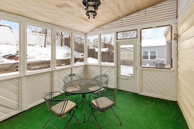 sunroom with vaulted ceiling and plenty of natural light