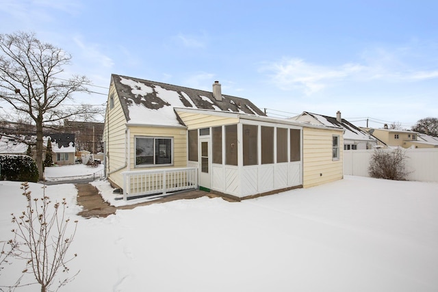 view of front of house featuring a sunroom