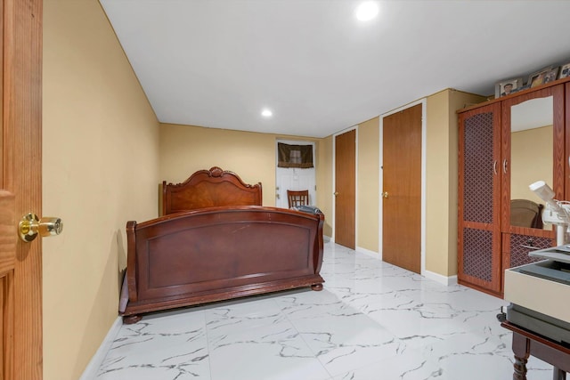 bedroom featuring multiple closets