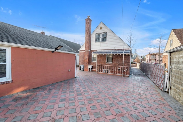 back of property featuring a patio area