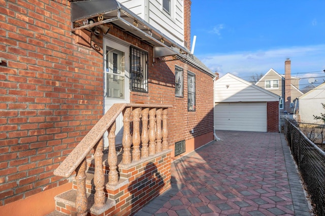 view of home's exterior featuring an outbuilding and a garage