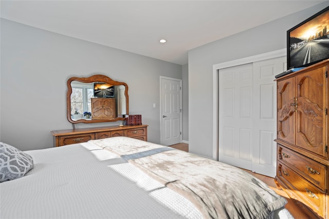 bedroom featuring a closet and light hardwood / wood-style flooring