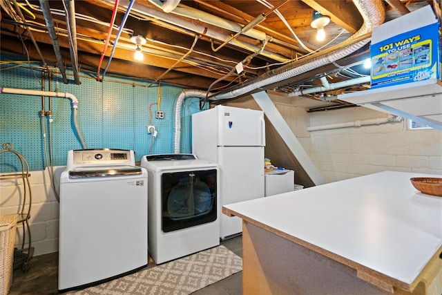 laundry area with independent washer and dryer