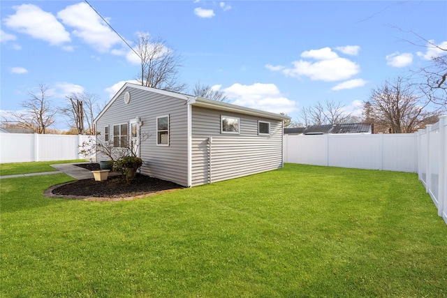 view of home's exterior with a yard