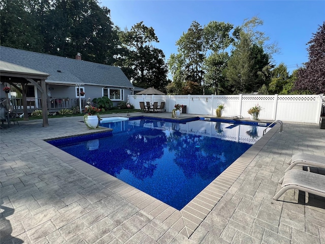 view of swimming pool featuring a patio area