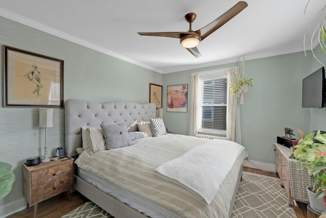 bedroom with hardwood / wood-style flooring, ceiling fan, and crown molding