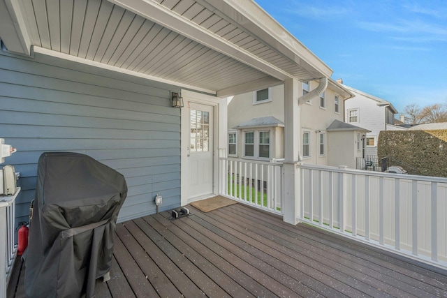 wooden terrace with area for grilling