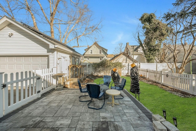 view of patio featuring a garage