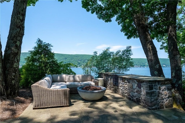 view of patio featuring a water view