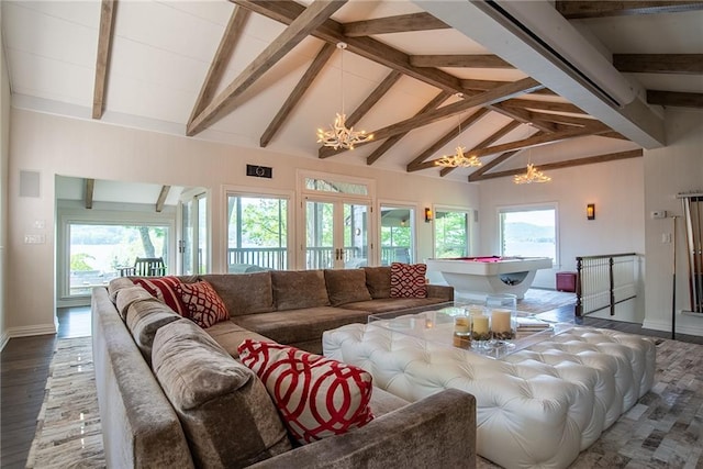 living room featuring hardwood / wood-style floors, beam ceiling, a notable chandelier, and a healthy amount of sunlight