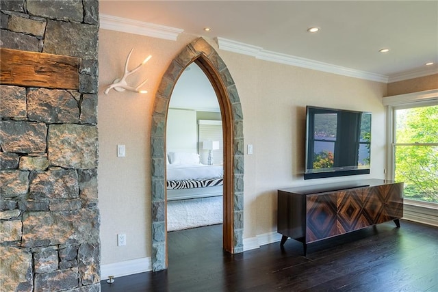 hallway with dark hardwood / wood-style flooring and ornamental molding