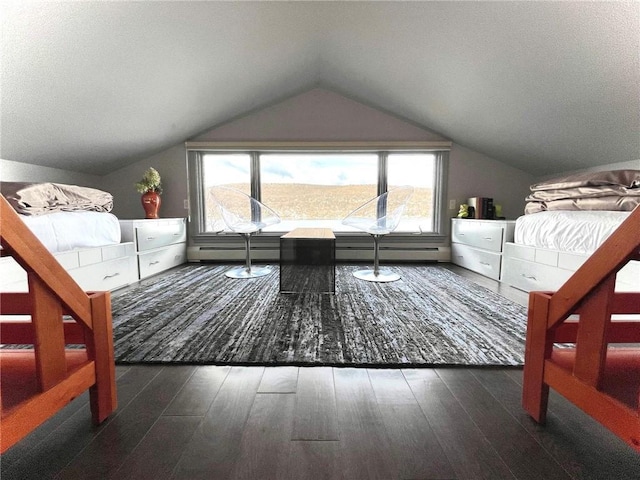 bedroom featuring a textured ceiling, dark wood-type flooring, and vaulted ceiling