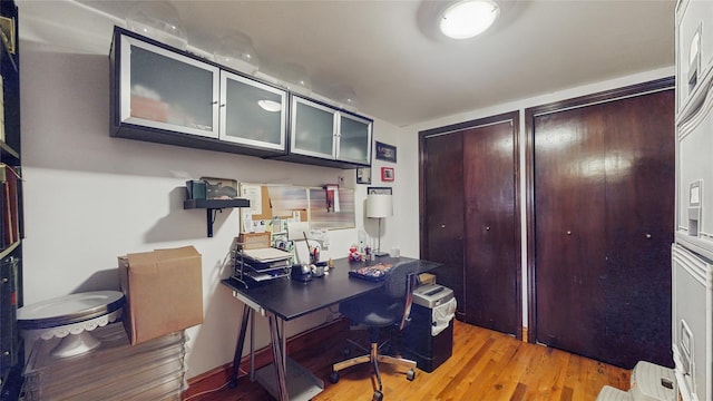 office area with light hardwood / wood-style floors