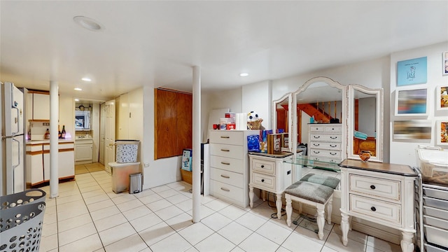 kitchen featuring light tile patterned floors and white refrigerator