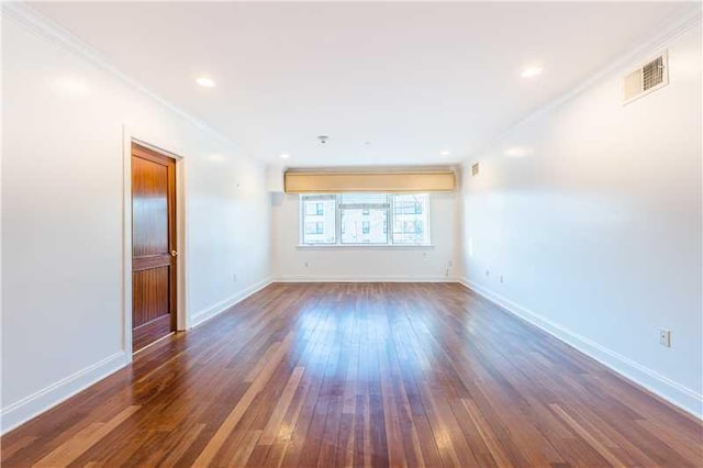 unfurnished room featuring dark hardwood / wood-style flooring and ornamental molding