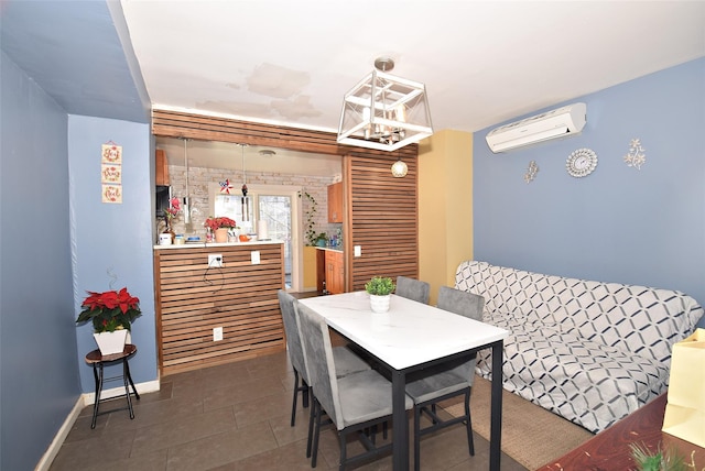 tiled dining space featuring a wall mounted AC