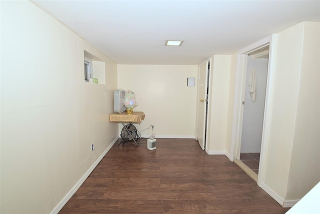 hallway featuring dark hardwood / wood-style flooring