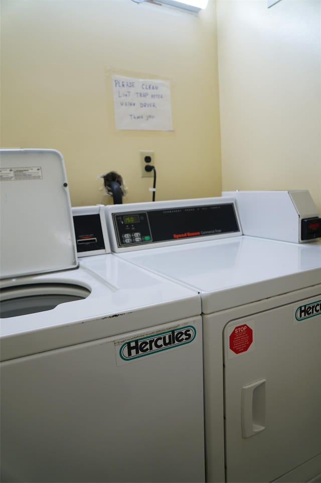 washroom with washing machine and dryer