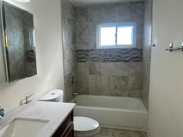 full bathroom featuring vanity, toilet, and tiled shower / bath