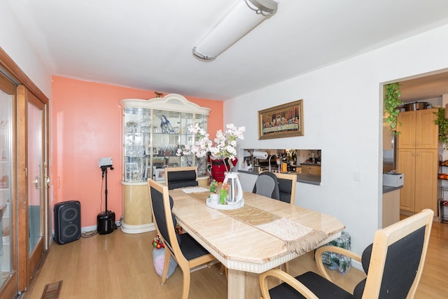 dining room featuring light hardwood / wood-style floors