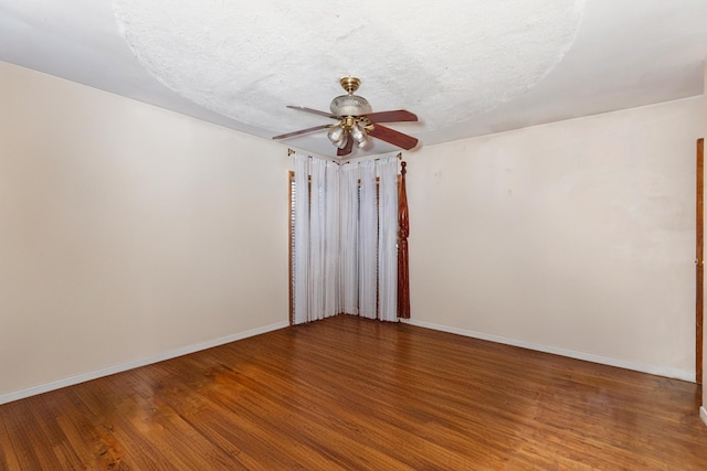 unfurnished room with a textured ceiling, hardwood / wood-style floors, and ceiling fan