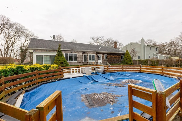 view of swimming pool with a deck