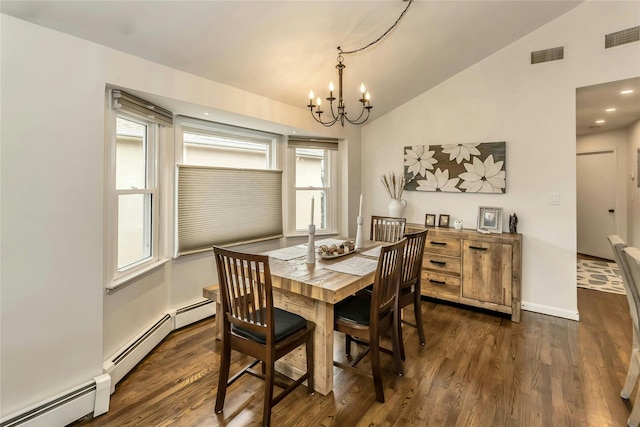 dining area with an inviting chandelier, a healthy amount of sunlight, dark wood-type flooring, and vaulted ceiling