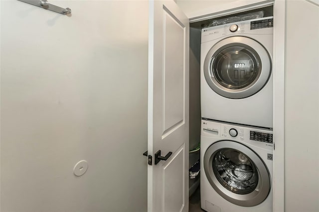 washroom with stacked washer and clothes dryer