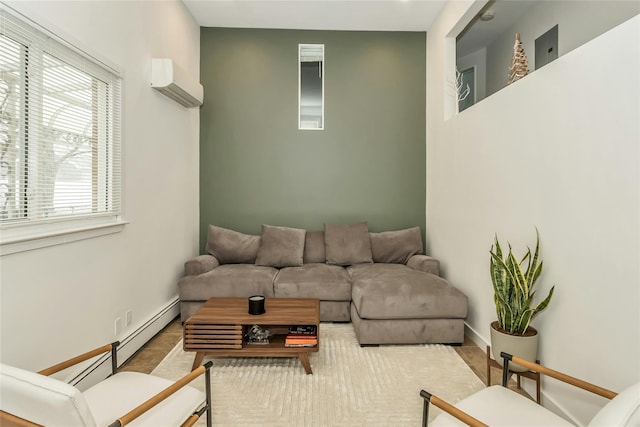 living room featuring an AC wall unit and a healthy amount of sunlight