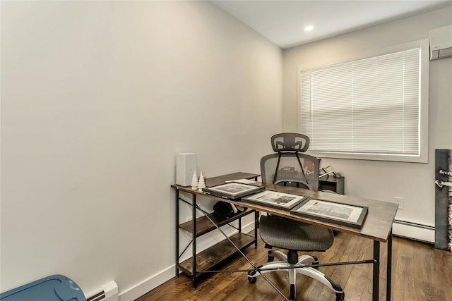 office with dark hardwood / wood-style floors, an AC wall unit, and baseboard heating