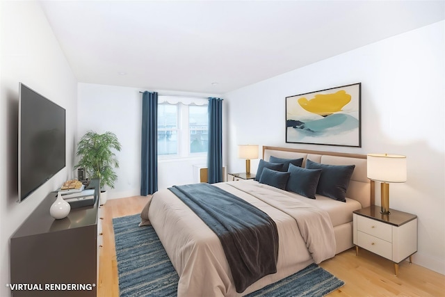 bedroom with light hardwood / wood-style flooring