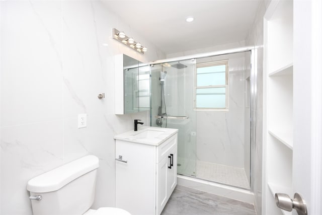 bathroom featuring a shower with shower door, tile walls, toilet, and vanity